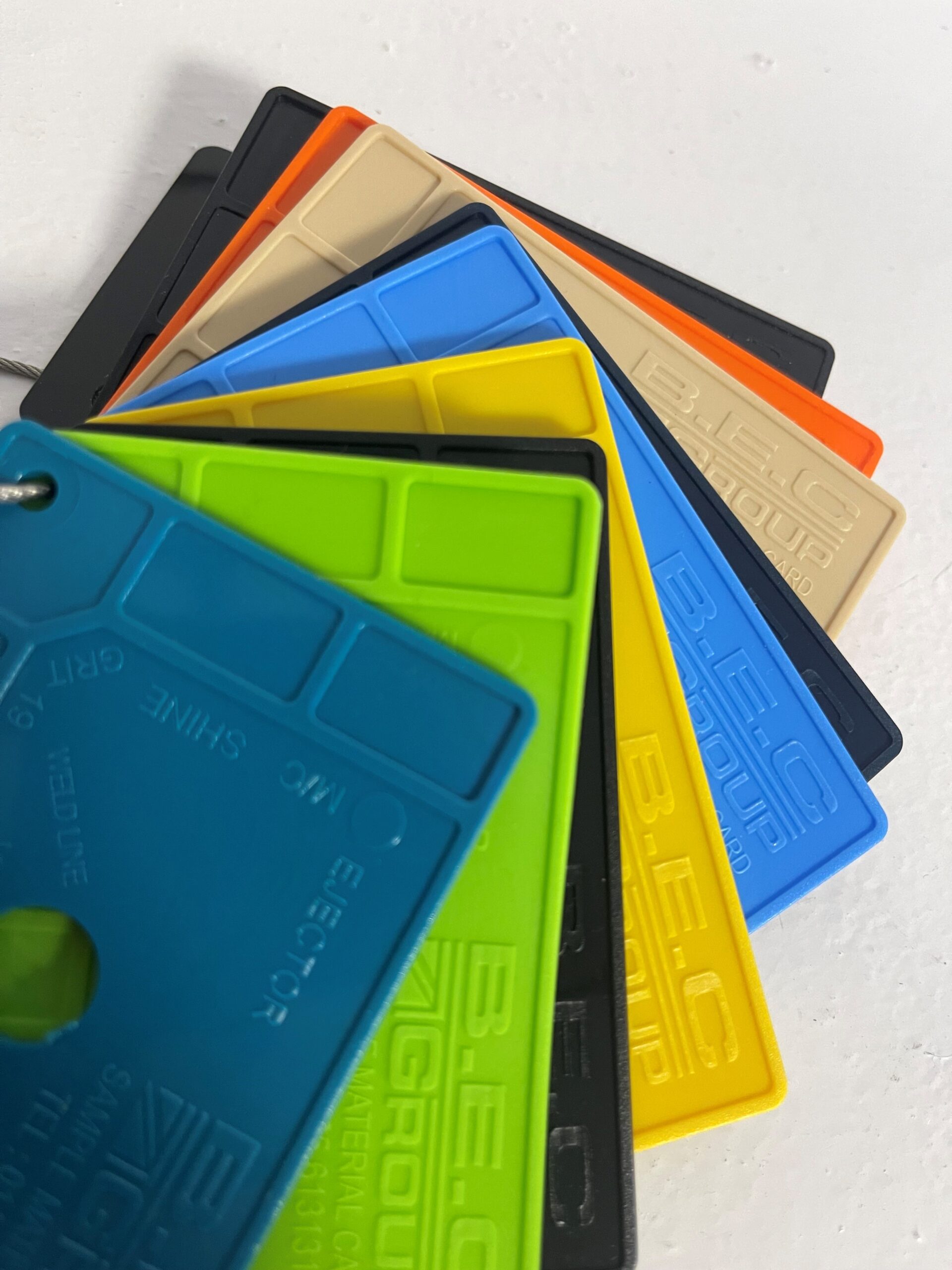 Multi-coloured plastic cards fanned out on a desk