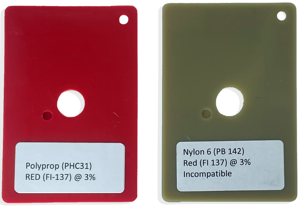 Two plastic rectangles, one red and one green-brown with stickers on them,