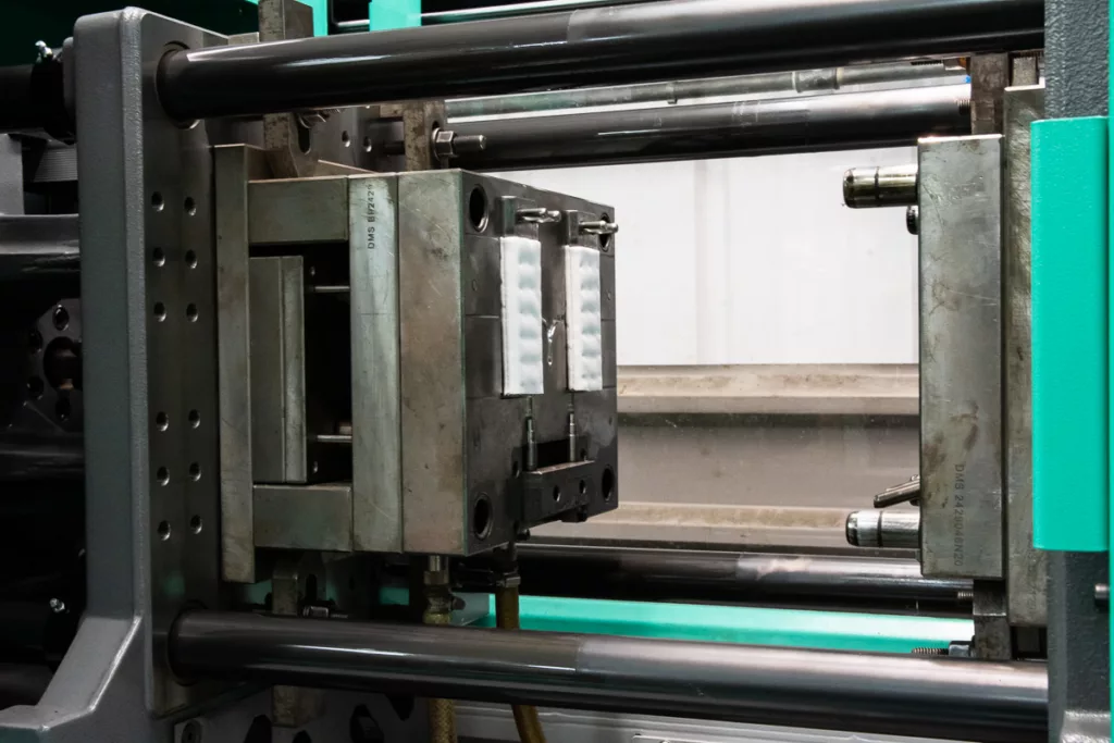 An example of a filter being manufactured in an injection moulding machine.