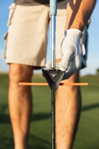 A golfer using the V Plane Golf Training Aid